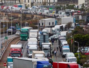 Britain, France ease transport ban as virus variant threatens supply chains