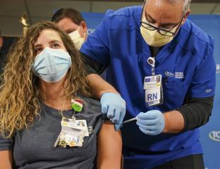 Europe eases UK travel bans as US passes one million vaccinations