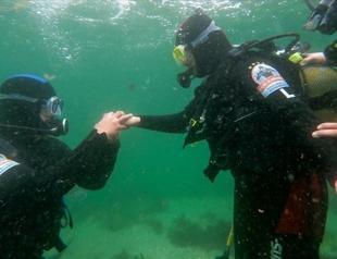 She said yes under the deep blue sea