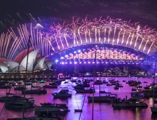 World ushers in New Year in shadow of pandemic