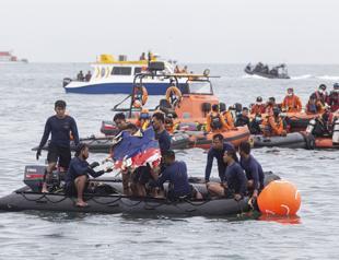 Body parts found at Indonesian plane crash site