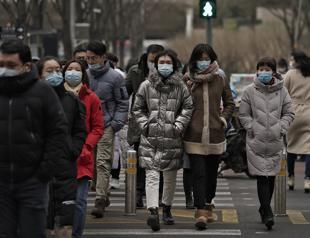 China logs first virus death in 8 months as WHO huddles on new strains