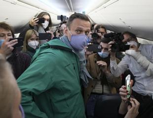 Police detain Kremlin critic Navalny on arrival in Russia