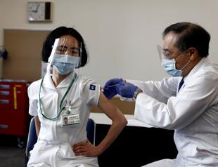 Japan starts vaccinations as new coronavirus cases, deaths drop worldwide