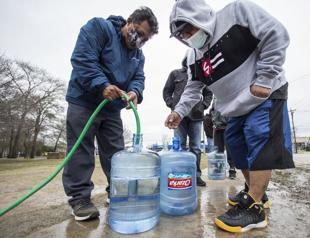 Lights come back on in Texas as water woes rise in the South