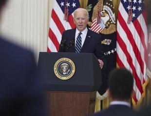 Biden vows action on migrants as he defends border policy
