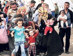 Turkish officials urge international burden-sharing on Syria