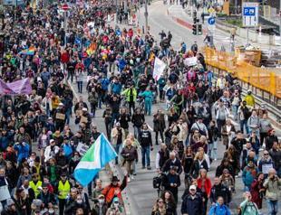 Germans protest in thousands against virus curbs