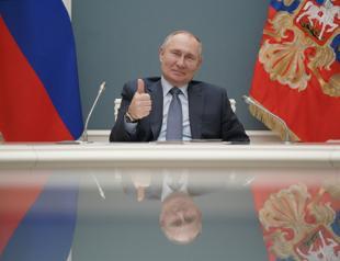 Putin signs law allowing him 2 more terms as Russia’s leader