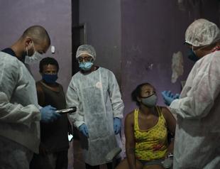 Brazil’s daily deaths from COVID pass 4,000 for first time