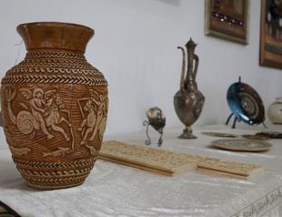 Women adorn Roman designs on clothing, ceramics