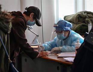 China weighs carrots and sticks in push to vaccinate millions