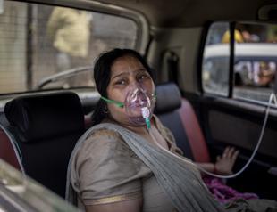 India COVID death toll passes 200,000, Biden hails stunning US progress