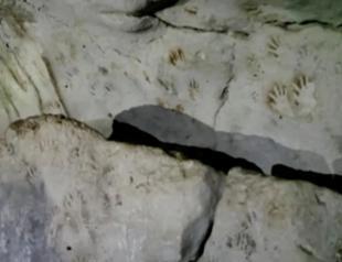 In Mexico, ancient Maya cave reveals mysterious painted hand prints