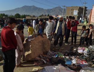 Afghans begin burying dead from bloody school blasts