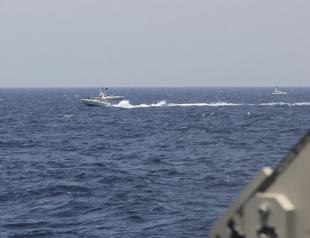 US ship fires warning shots in encounter with Iranian boats