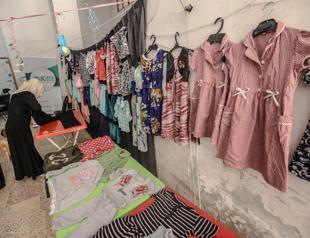 Tailors drape Eid clothing for Syrian children in Idlib