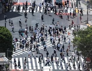 Japan to lift virus emergency one month before Olympics