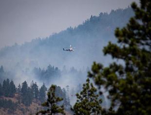 Military put on standby to evacuate fire-threatened towns in western Canada