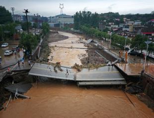 Tens of thousands evacuated as China storms spread northwards