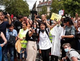 Big protests mark global anger at COVID restrictions