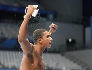 Tunisian teen wins surprise Olympic swimming gold