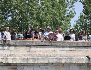 Flowers left in Tunca River in memory of Roma killed at Auschwitz camp