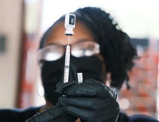 US rebuffs call for COVID booster jab moratorium as China curbs travel