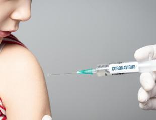 Children may get virus shot before schools reopen