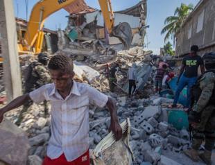 Death toll in massive Haiti quake jumps to over 1,300