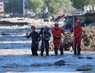 Efforts continue to search for missing people in flood-hit towns