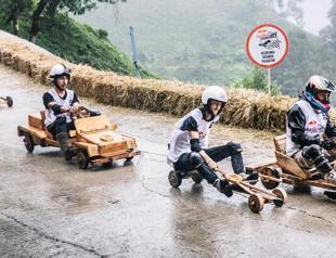 Locals race downhill with handmade wooden cars