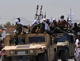 Taliban show off US plunder as first flight lands in Kabul since pullout