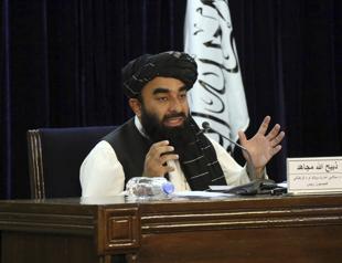 Taliban announce hardline government as protests grow