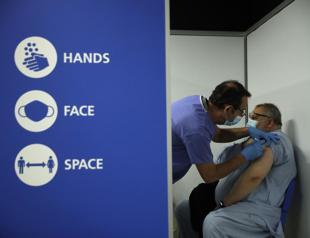 UK counts on vaccines, common sense to keep virus at bay