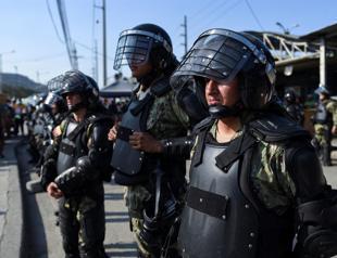 Police regain control of Ecuador prison after riot carnage