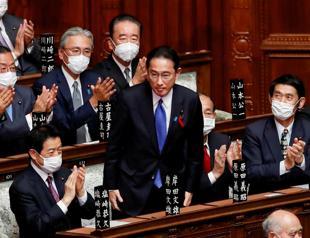 Japan’s Parliament elects former diplomat Kishida as new PM