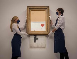 Half-shredded Banksy fetches $25.4 mln on return