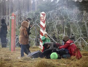 Poland blocks migrants at Belarus border, warns of armed escalation