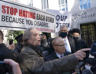 Trump ally Bannon surrenders to face Capitol riot probe charges