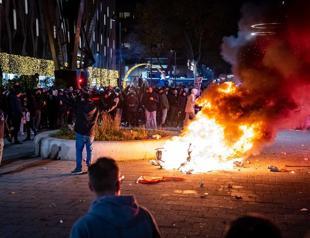 Dutch police fire warning shots as Covid riots hit Rotterdam