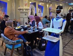 Robot waiters take Iraq’s Mosulites back to the future