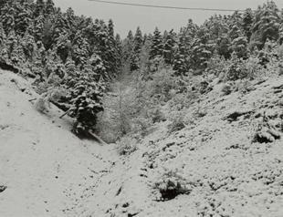 East blanketed in snow, west battered by rain