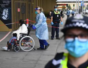 Travel curbs aimed at COVID variant tighten across the world