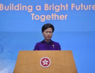 Hong Kong leader hails patriots only vote despite record low turnout