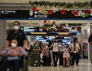 US halves asymptomatic COVID isolation period as cases surge worldwide