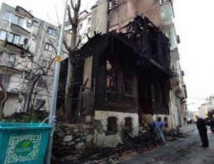 Massive fire in wooden building injures two