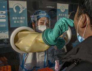 China locks down third city, raising affected to 20 million