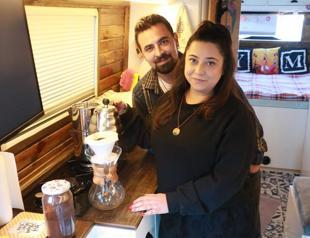 Couple live in ‘caravan’ they converted from clunker bus