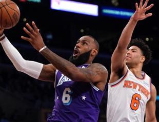 LeBron returns with triple-double